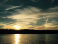 Bright circle in the sky at sunset Conesus Lake NY image 759