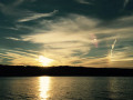 Bright circle in the sky at sunset Conesus Lake NY image 762