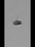 Disc shaped object photographed over beach image 811