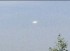 Elongated bright light seen in a cloudless sky image 1