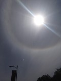 circular object approaching the halo of the sun image 442