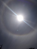 circular object approaching the halo of the sun image 443